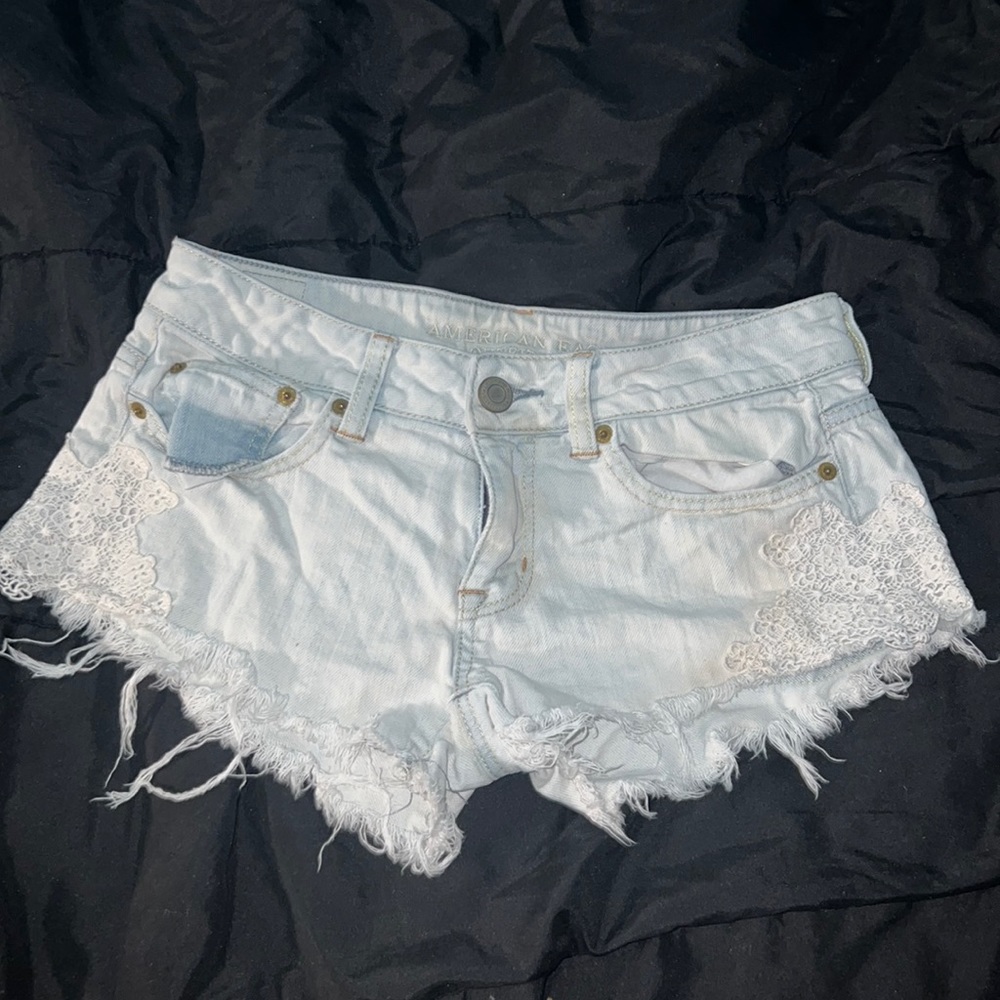 Distressed light blue shorts